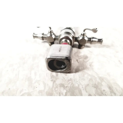 Silver metallic karl storz diagnostic arthro sheath faucet valve with square body and two side handles for arthroscopy