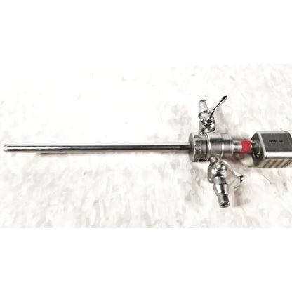 Silver karl storz diagnostic arthro sheath with long slender metallic shaft and multiple control knobs on handle