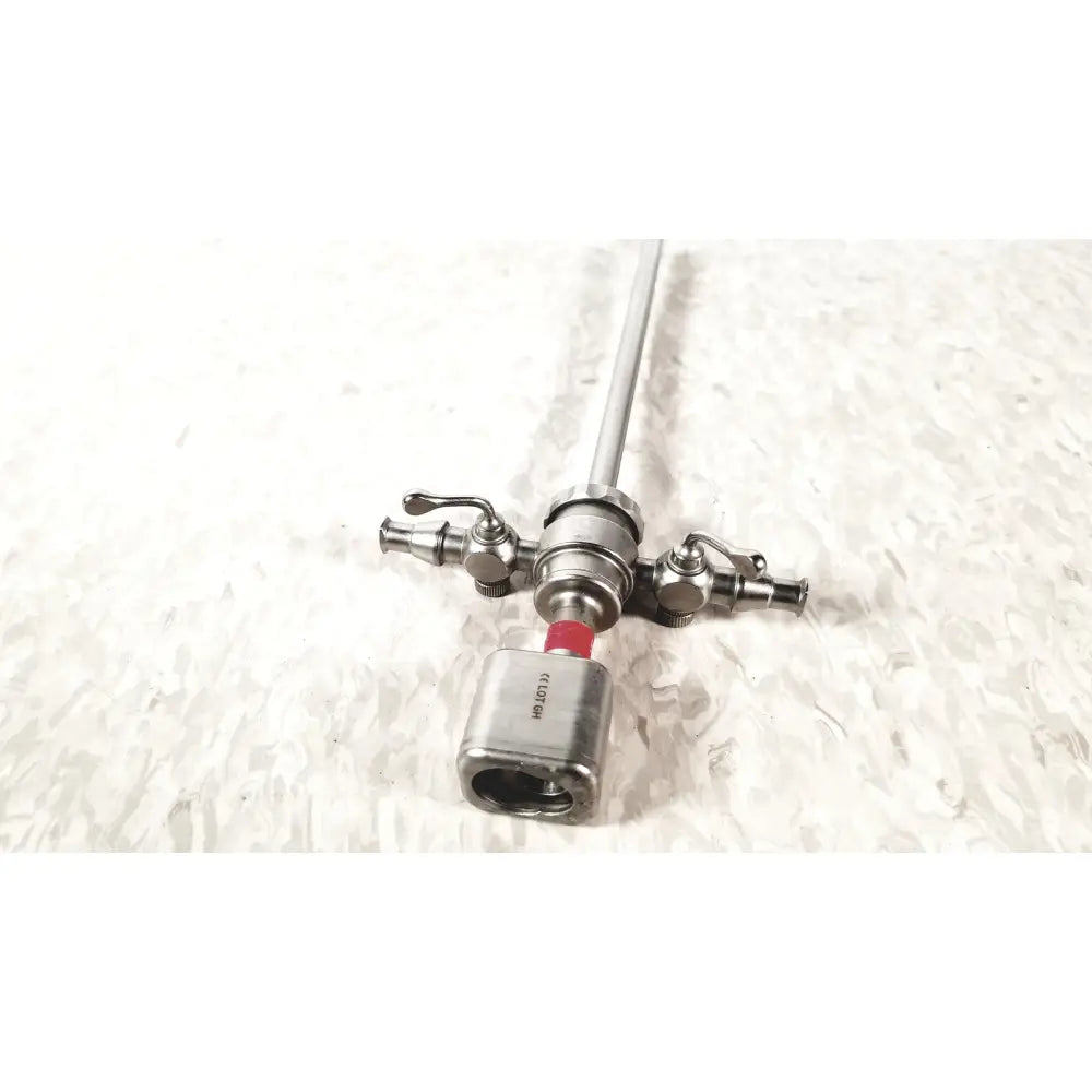 Silver karl storz diagnostic arthro sheath with long slender shaft and three metallic handles for surgical use