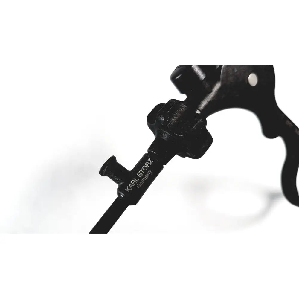 Black karl storz clickline laparoscopic grasper insert with textured grip and metallic shaft for surgical use