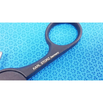 Black surgical scissors with karl storz germany engraved on black clickline monopolar plastic handle