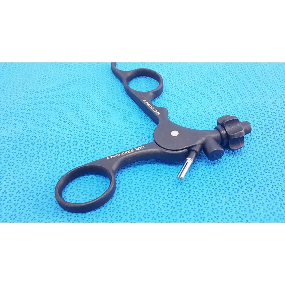 Black plastic karl storz clickline monopolar plastic handle with textured grip and metallic tip for laparoscopic use