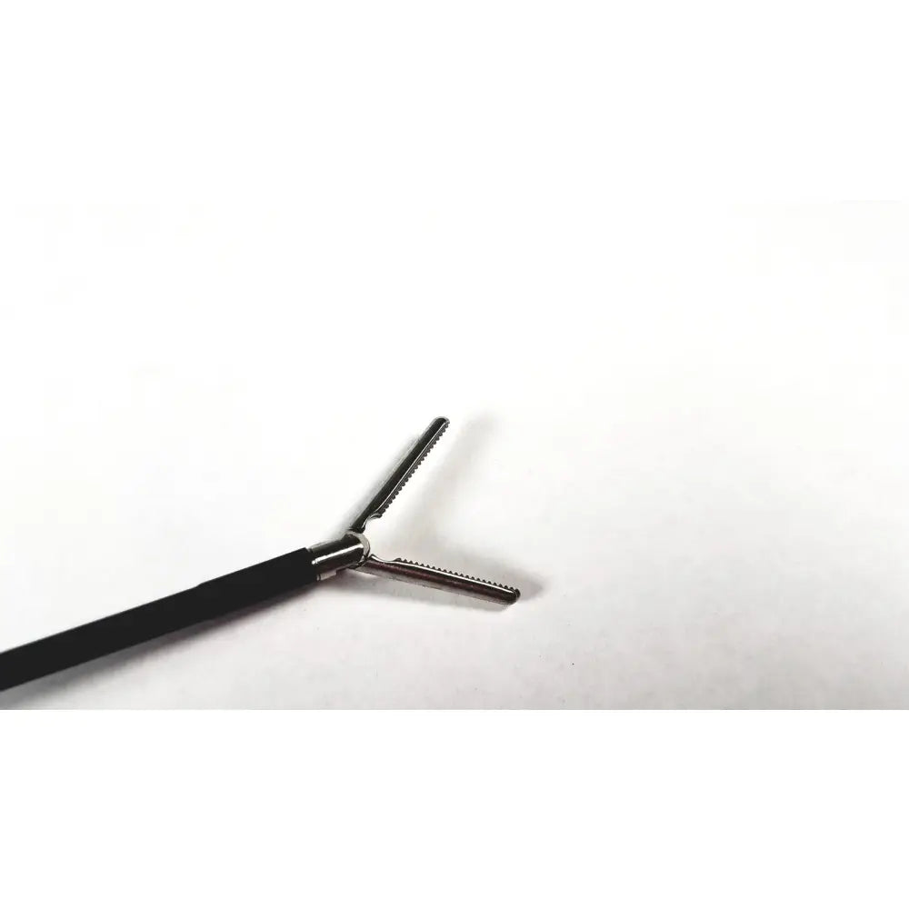 Black-handled karl storz endoscopy handle with metallic serrated jaws for precise surgical medical equipment use