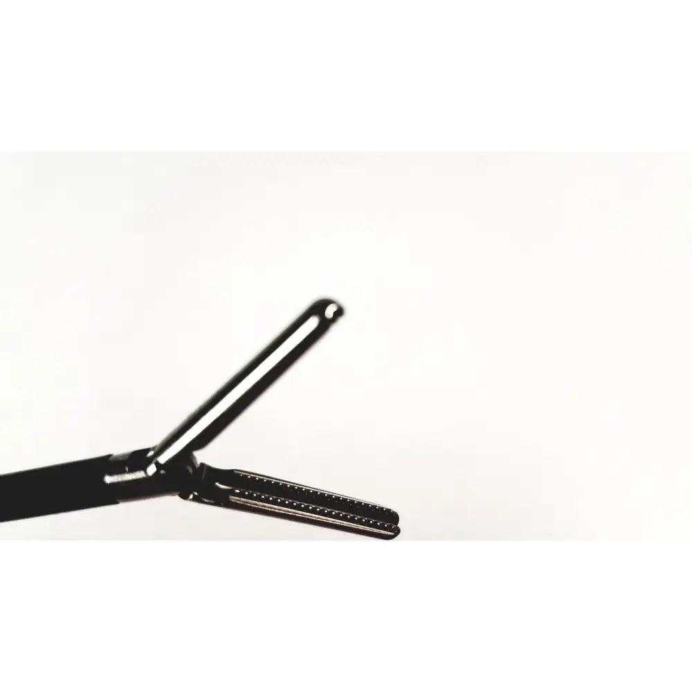 Black-handled karl storz endoscopy handle with metallic serrated jaws for precise surgical medical equipment use