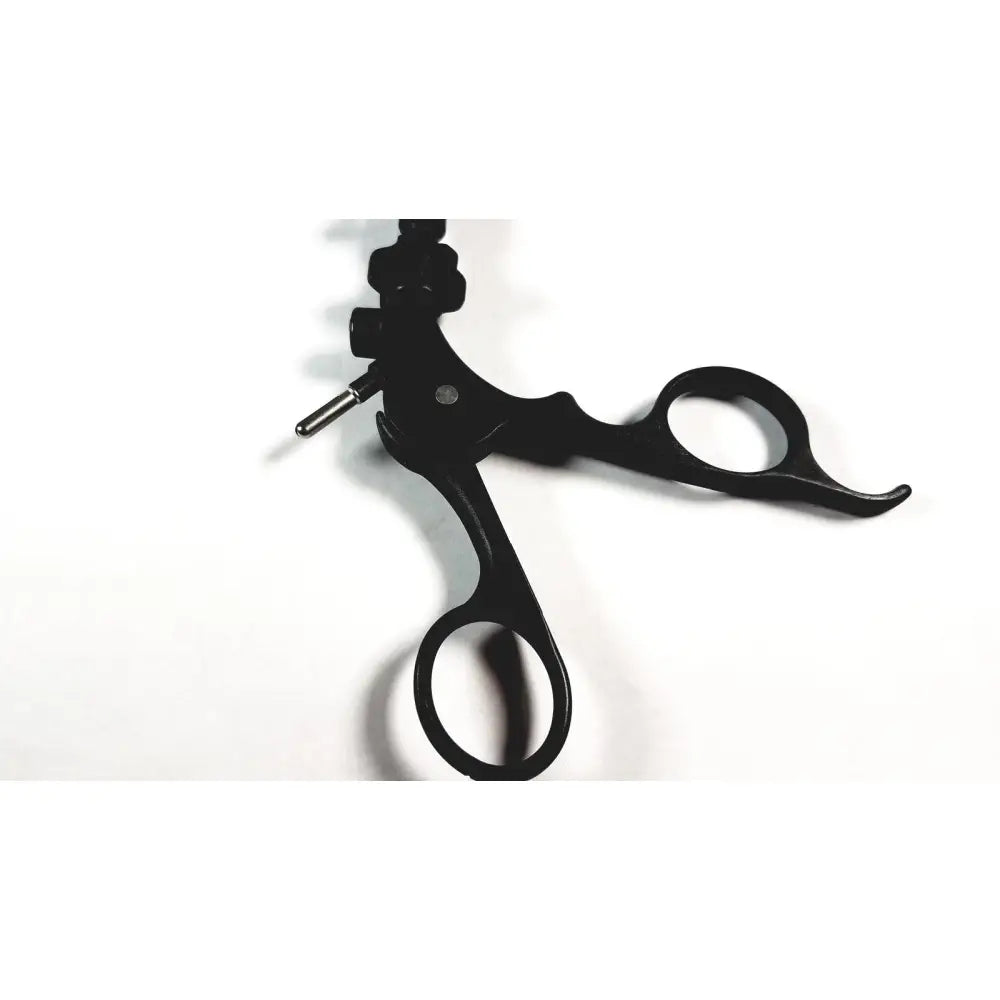 Black karl storz surgical handle with ergonomic grips and metallic adjustment knob for endoscopy instrument use