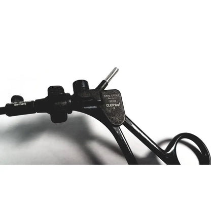 Black metal karl storz clickline handle with ergonomic grips and labeled brand plate for insulated shaft laparoscopic use