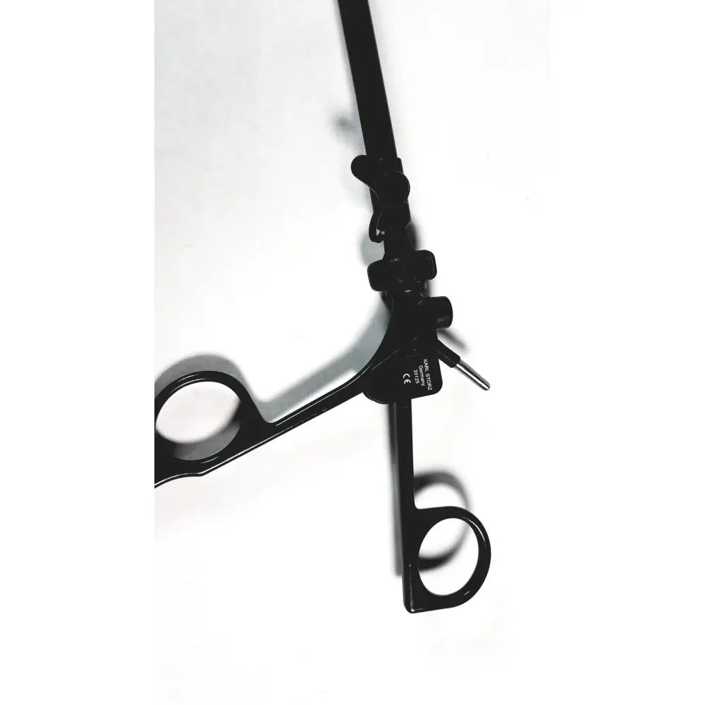 Black Karl Storz monopolar surgical handle with ergonomic grips and precision-tipped mechanism for electrosurgical use