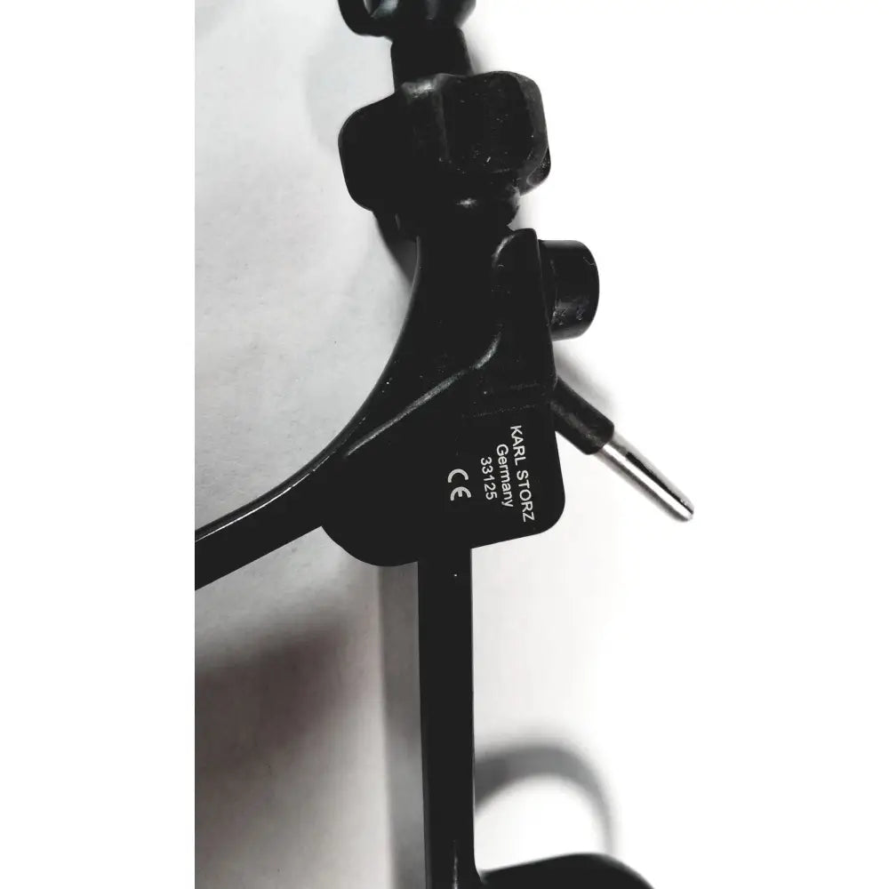 Black plastic monopolar surgical handle karl storz 33125 with engraved branding and model number visible