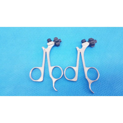 Silver surgical forceps with black textured knobs featuring karl storz clickline handle for laparoscopic surgical use lot of 2