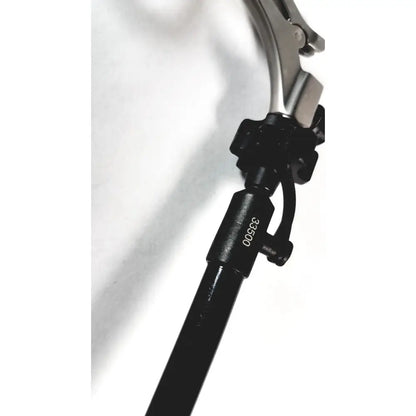 Black karl storz clickline handle with metallic articulated head and engraved serial number 38500 for shaft laparoscopic surgical use