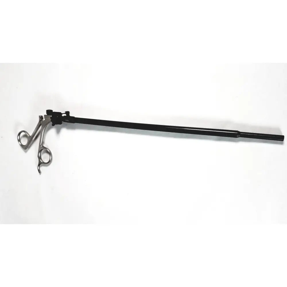 Black-handled Karl Storz clickline handle with metallic articulated jaws and a long shaft laparoscopic surgical tool