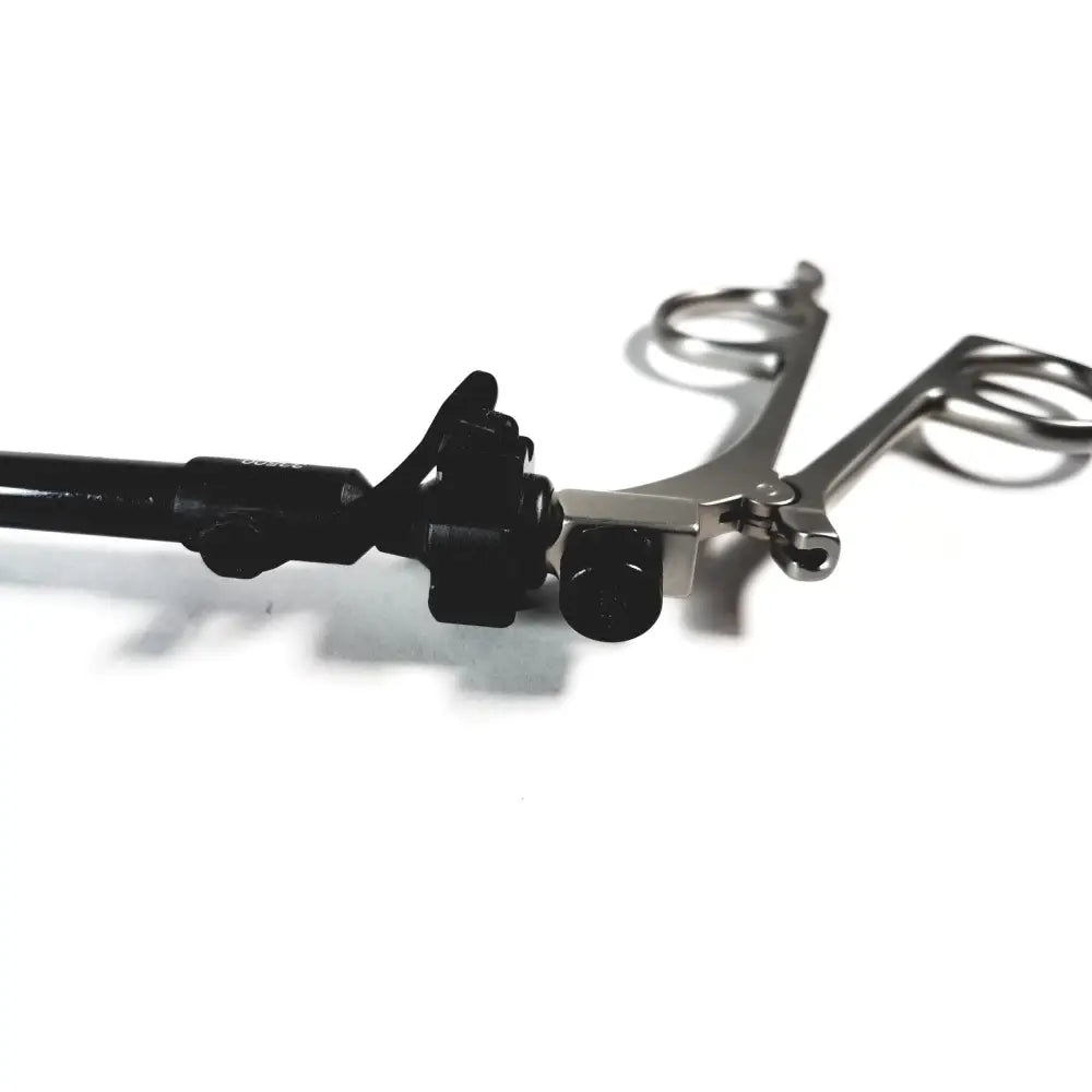 Black and silver karl storz clickline handle with textured grip and metallic jaws for precise shaft laparoscopic surgical use