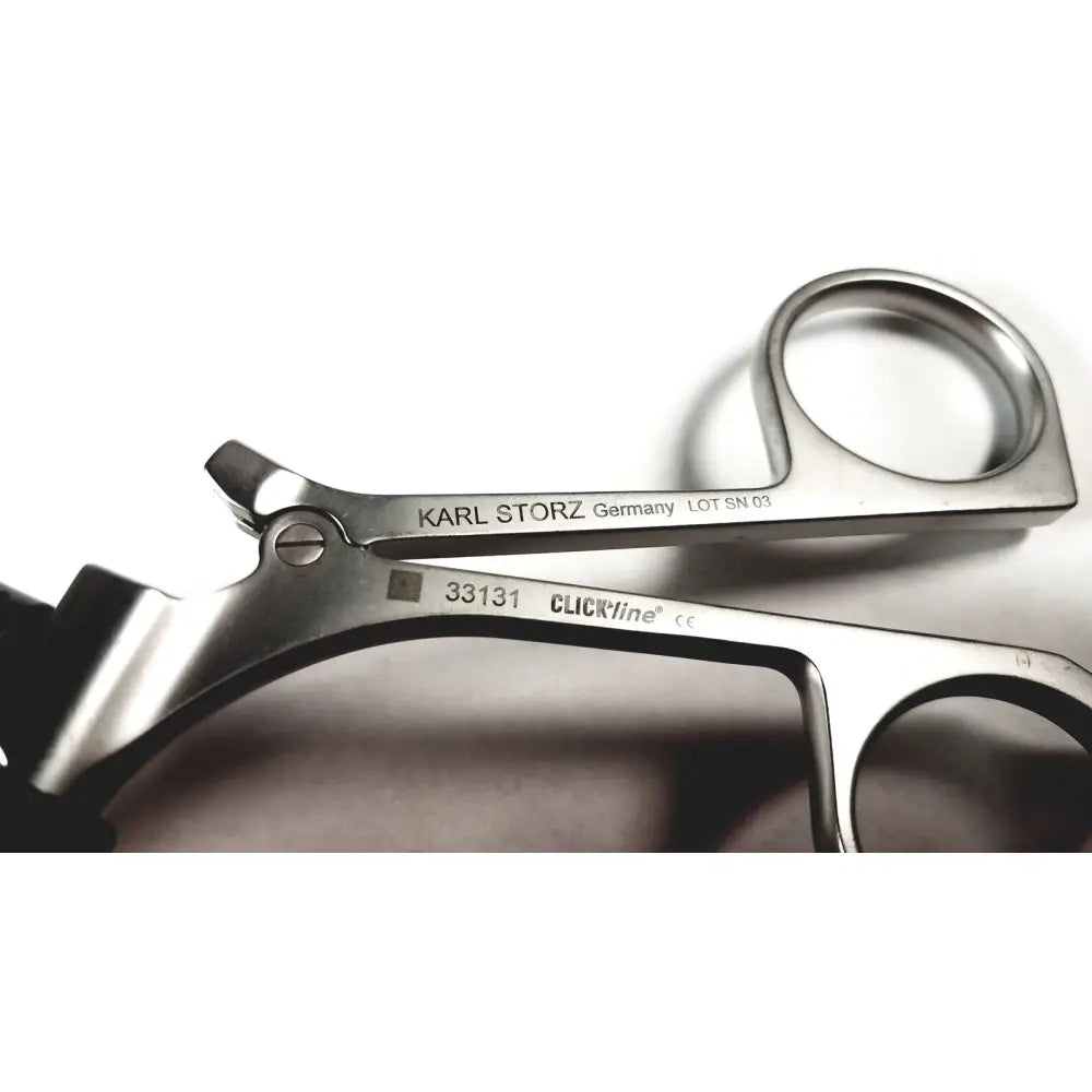 Silver surgical forceps with clickline metal handle featuring polished finish and karl storz engraved branding germany