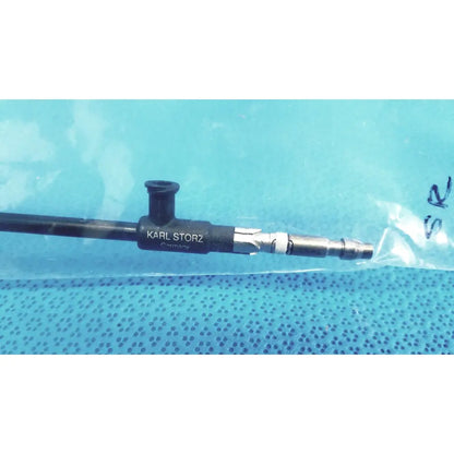 Black karl storz insulated outer tube surgical endoscope with metallic connectors and textured grip for precise handling