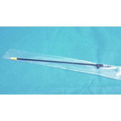 Black karl storz insulated outer tube with yellow tip and metallic joint packaged in clear plastic for surgical use