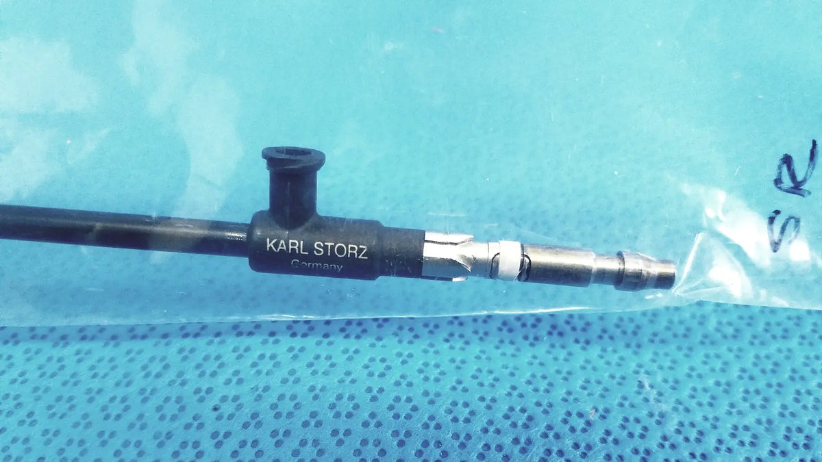 Black karl storz insulated outer tube surgical endoscope with metallic connectors and textured grip for precise handling