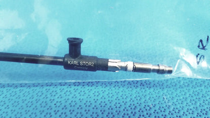 Black karl storz insulated outer tube surgical endoscope with metallic connectors and textured grip for precise handling