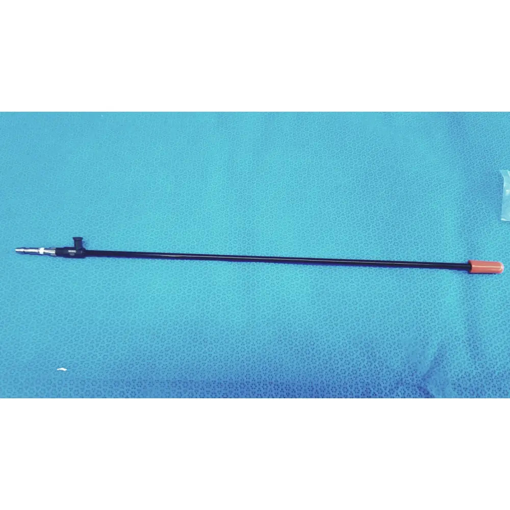 Black karl storz 33300 outer tube clickline instrument with metallic tip and orange cap for surgical use