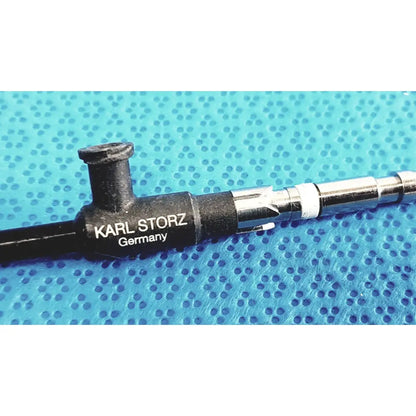 Black and silver karl storz clickline insulated outer sheath surgical instrument with karl storz germany engraving