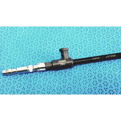 Black and silver karl storz clickline insulated outer sheath with metallic tip and engraved markings for surgical use