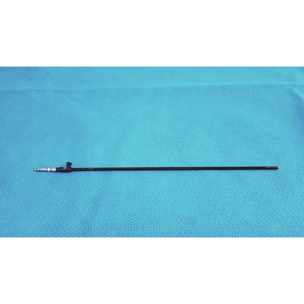 Black karl storz clickline surgical scope with metallic tip and small knob featuring insulated outer sheath design