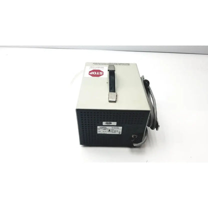 Beige and black metal handled power supply unit with coiled gray cables and warnings for Karl Storz endoscopy 27224p pump back side
