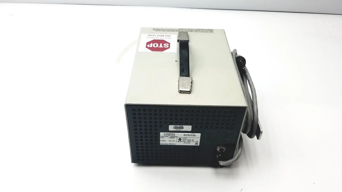 Beige and black metal handled power supply unit with coiled gray cables and warnings for Karl Storz endoscopy 27224p pump back side