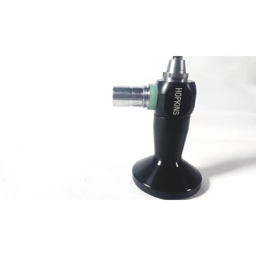 Black karl storz hopkins surgical torch with metallic nozzle and green accent ring for arthroscopic procedures
