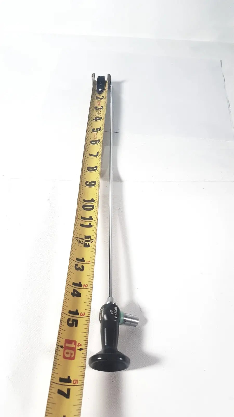 Slender metallic karl storz hopkins 10327 a 0 degree arthroscope with black ergonomic handle and silver joints
