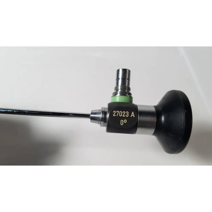 Black and silver karl storz hopkins 27023 a 0 degree endoscope with green ring for medical use