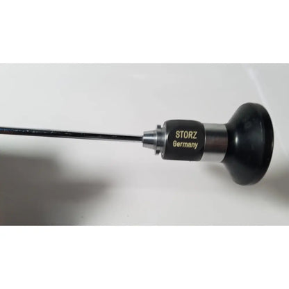 Black and silver Karl Storz Hopkins 27023 A 0 degree endoscope with sleek cylindrical design for precision imaging