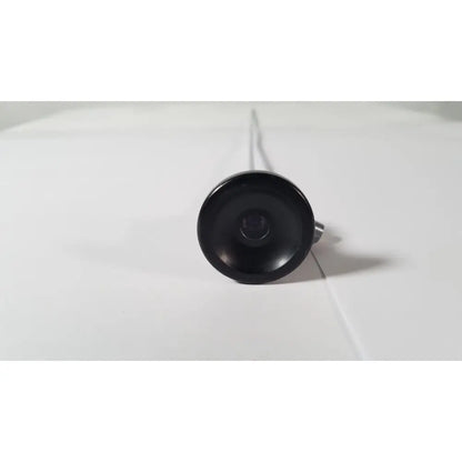 Black circular camera lens with metallic stem of karl storz hopkins 27023 a 0 degree endoscope front side view