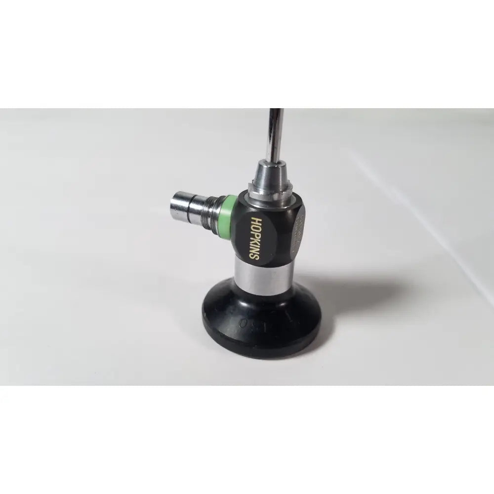 Black and silver karl storz hopkins 27023 a 0 degree endoscope with green accent ring for surgical use