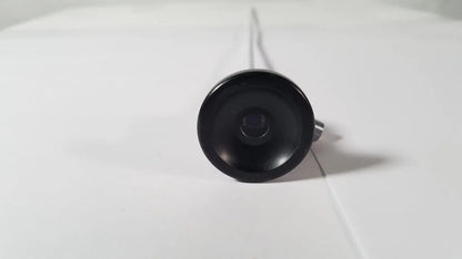 Black circular camera lens with metallic stem of karl storz hopkins 27023 a 0 degree endoscope front side view