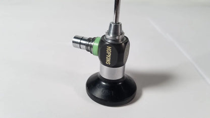 Black and silver karl storz hopkins 27023 a 0 degree endoscope with green accent ring for surgical use