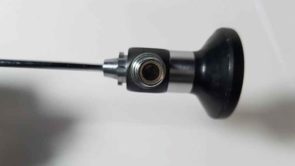 Black and silver karl storz hopkins 27023 a 0 degree endoscope with cylindrical handle metallic joint and flexible cable