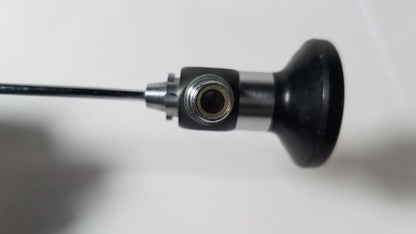 Black and silver karl storz hopkins 27023 a 0 degree endoscope with cylindrical handle metallic joint and flexible cable