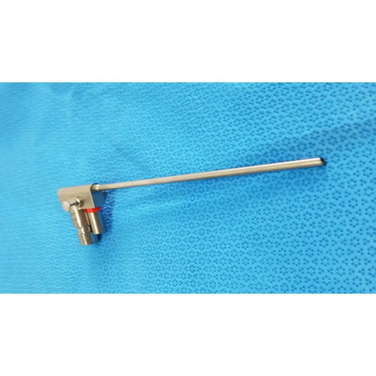 A karl storz hopkins metallic telescope with a long slender shaft and brass-colored fittings for surgical use