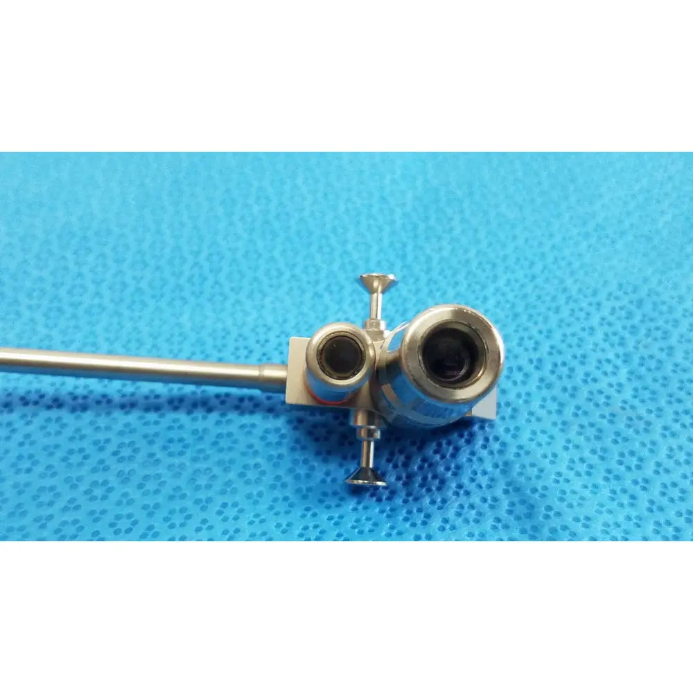 Silver karl storz hopkins surgical endoscope with dual lenses and slender metallic shaft for medical use