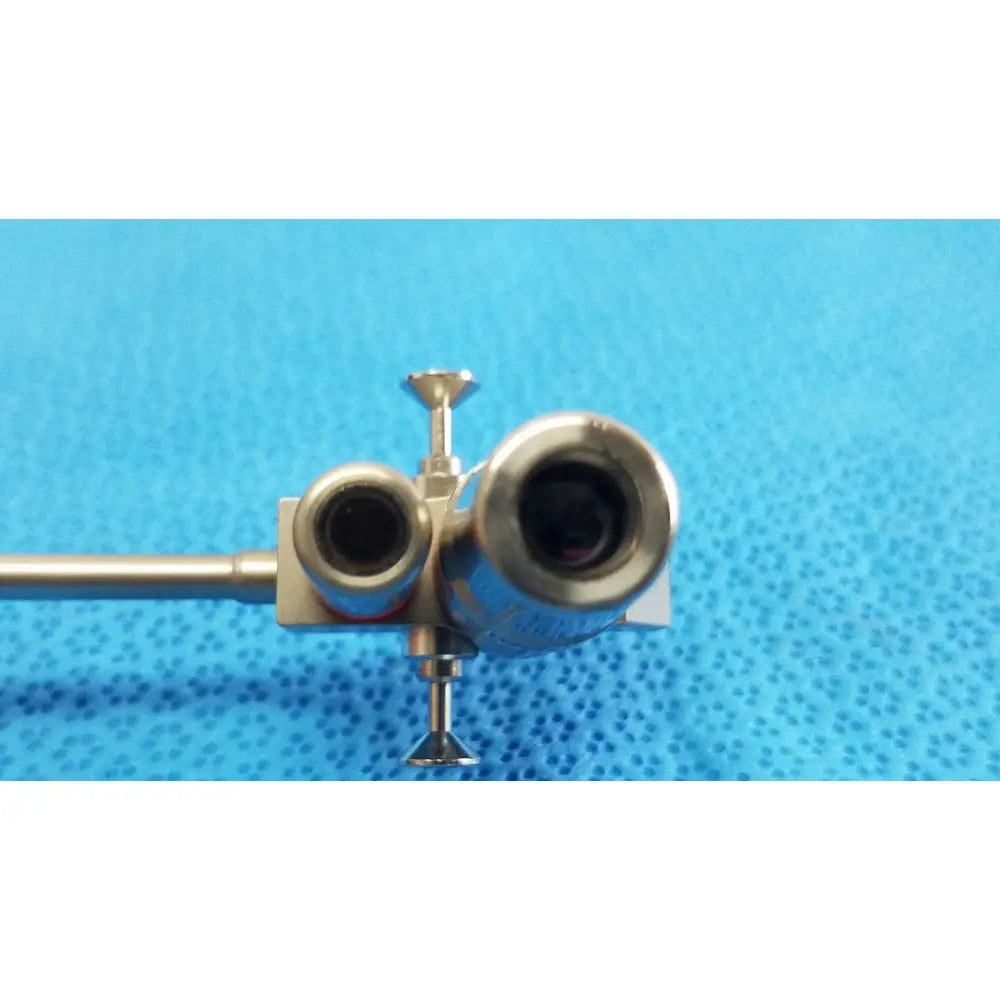 Silver karl storz hopkins surgical endoscope with dual lens ports and slender metallic shaft for medical use