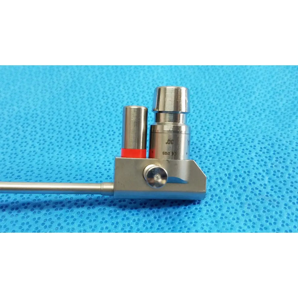 Silver karl storz hopkins 30º autoclavable telescope with cylindrical handle and red-capped metal component on base