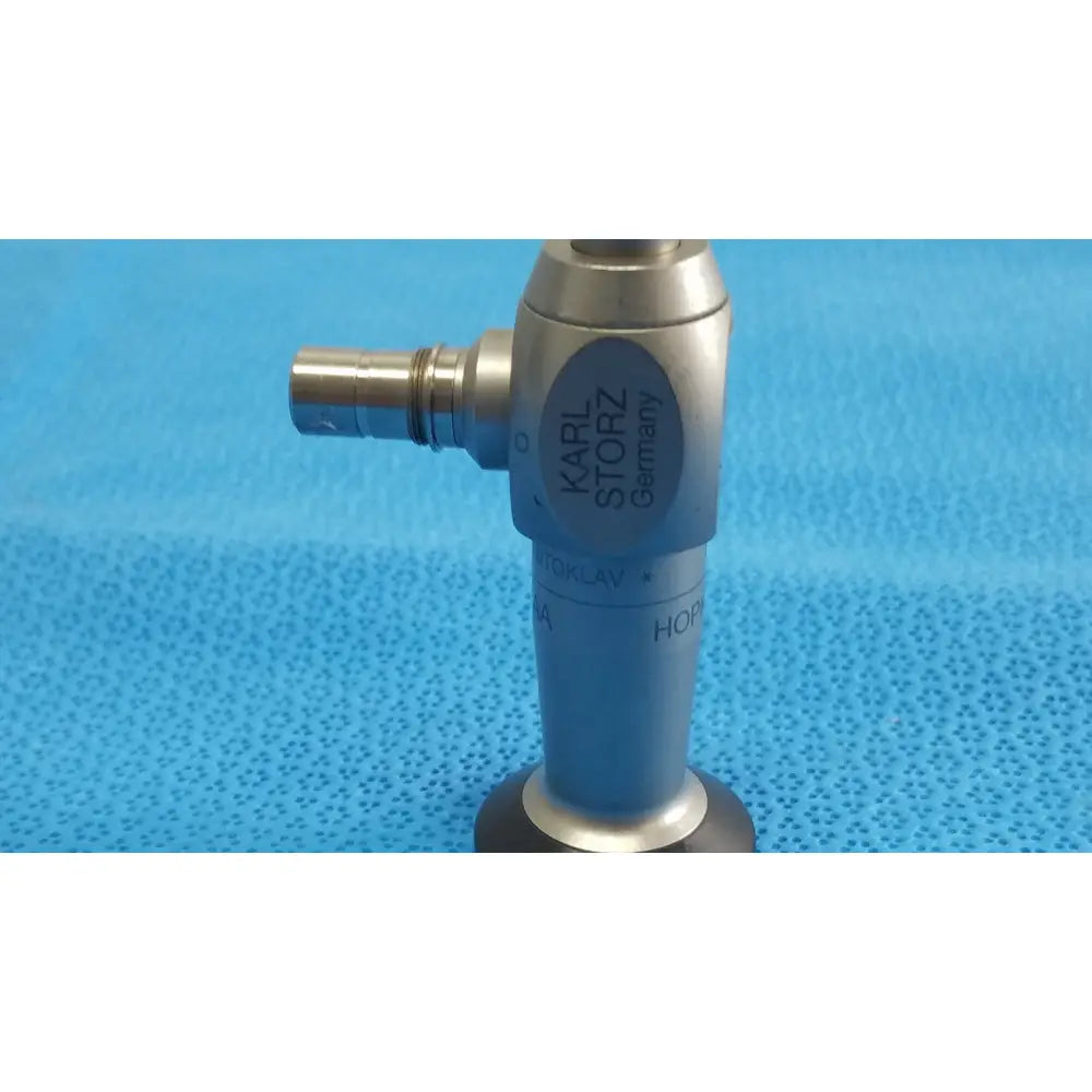Silver metallic karl storz hopkins ii 0 degree autoclavable laparoscope endoscope with blue karl storz germany label and black rubber base