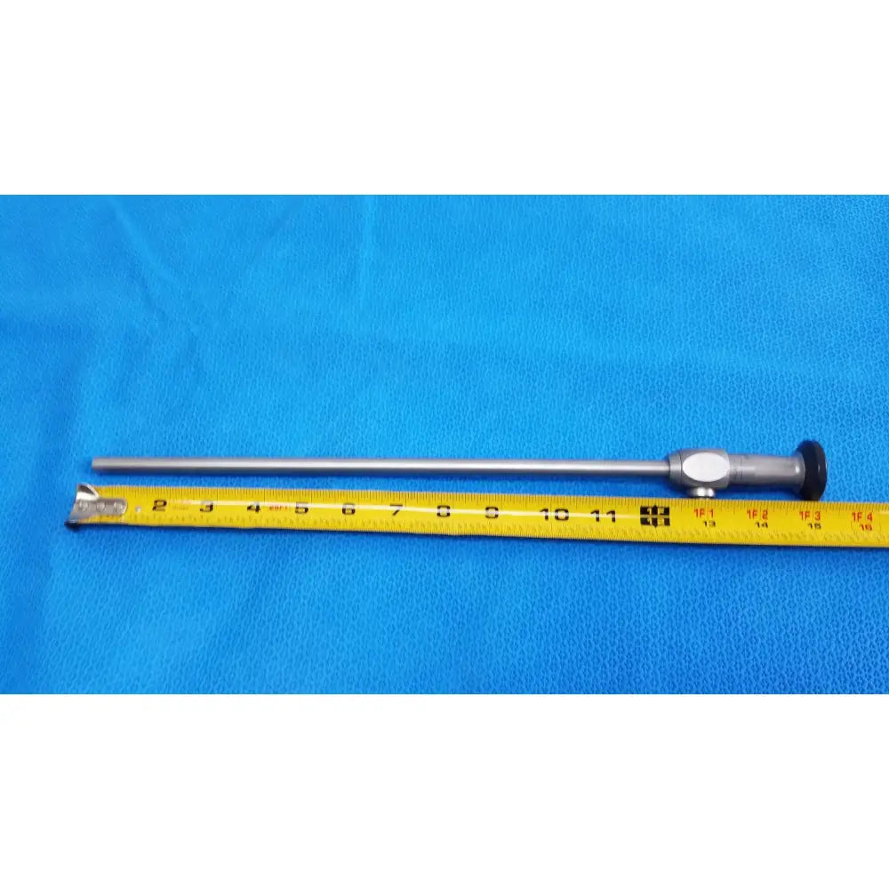 Silver karl storz hopkins ii 0° 26003 aa autoclavable laparoscope endoscope with black tip and metallic handle beside yellow tape
