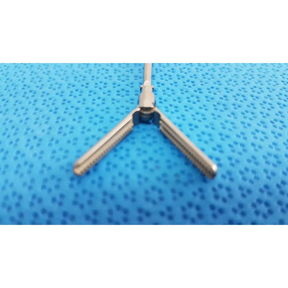 Stainless steel karl storz laparoscopic grasper model 33410 dyd with three prongs and central pivot point