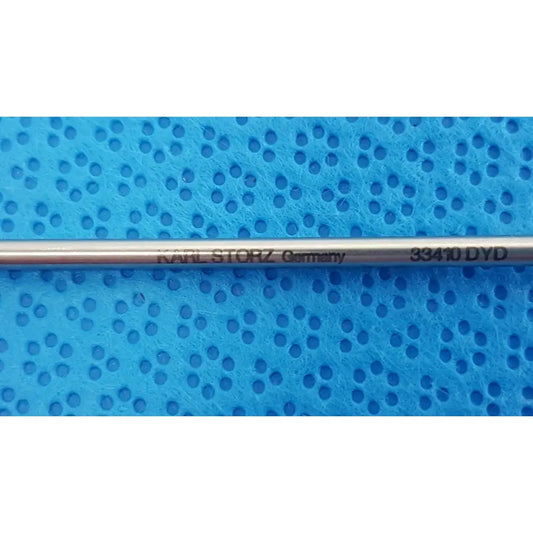 A sleek metallic karl storz laparoscopic grasper model 33410 dyd with engraved branding and model number