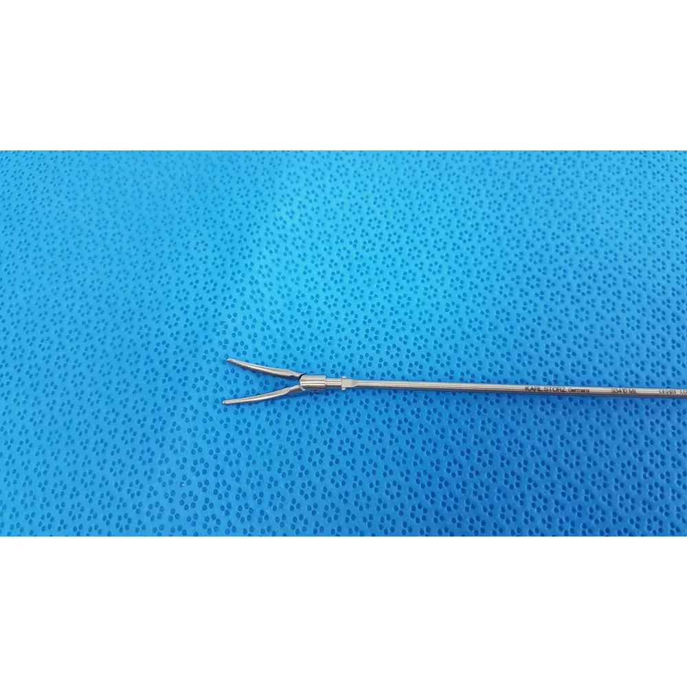 Silver surgical instrument with slender shaft and curved prongs for precision use karl storz laparoscopic grasper model 33410ML