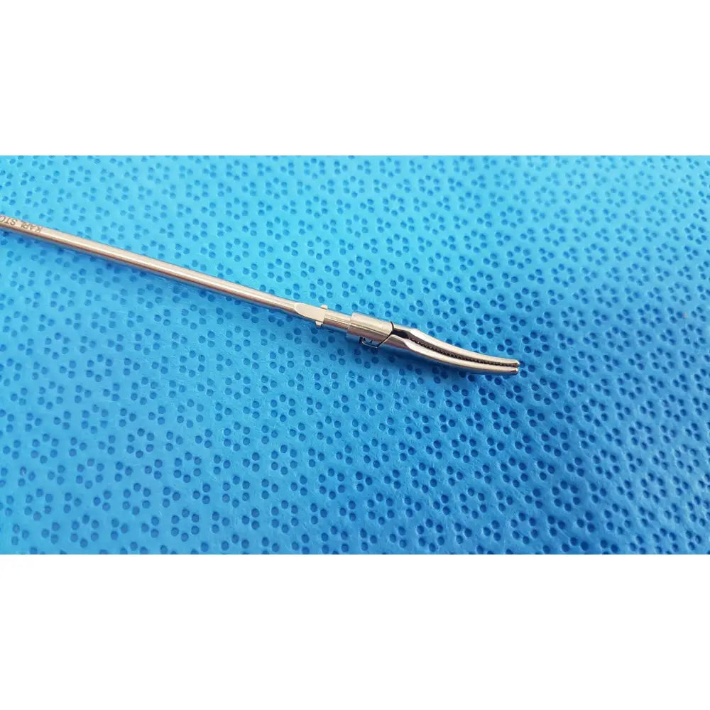 Silver karl storz laparoscopic grasper model 33410ml with long slender shaft and curved serrated jaws