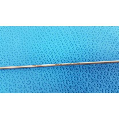Karl storz laparoscopic grasper model 33410ml slender metallic surgical instrument with engraved markings on blue surface