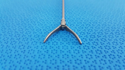 Silver karl storz laparoscopic grasper model 33410ml with long slender shaft and three-pronged serrated tips