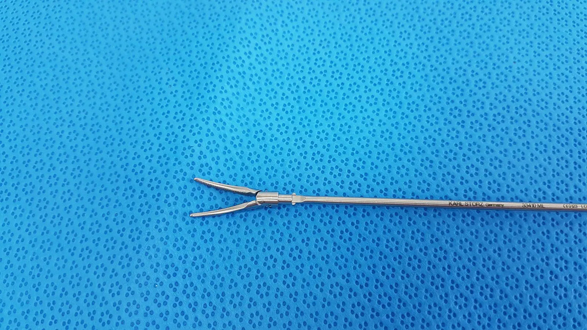 Silver surgical instrument with slender shaft and curved prongs for precision use karl storz laparoscopic grasper model 33410ML